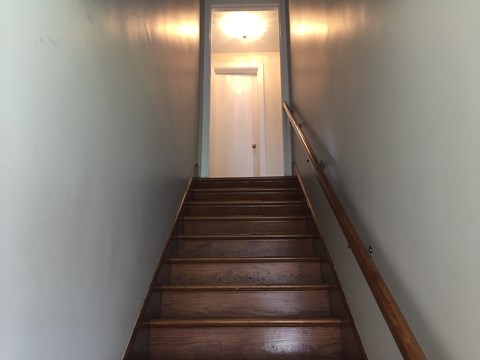 A staircase with a light at the top.