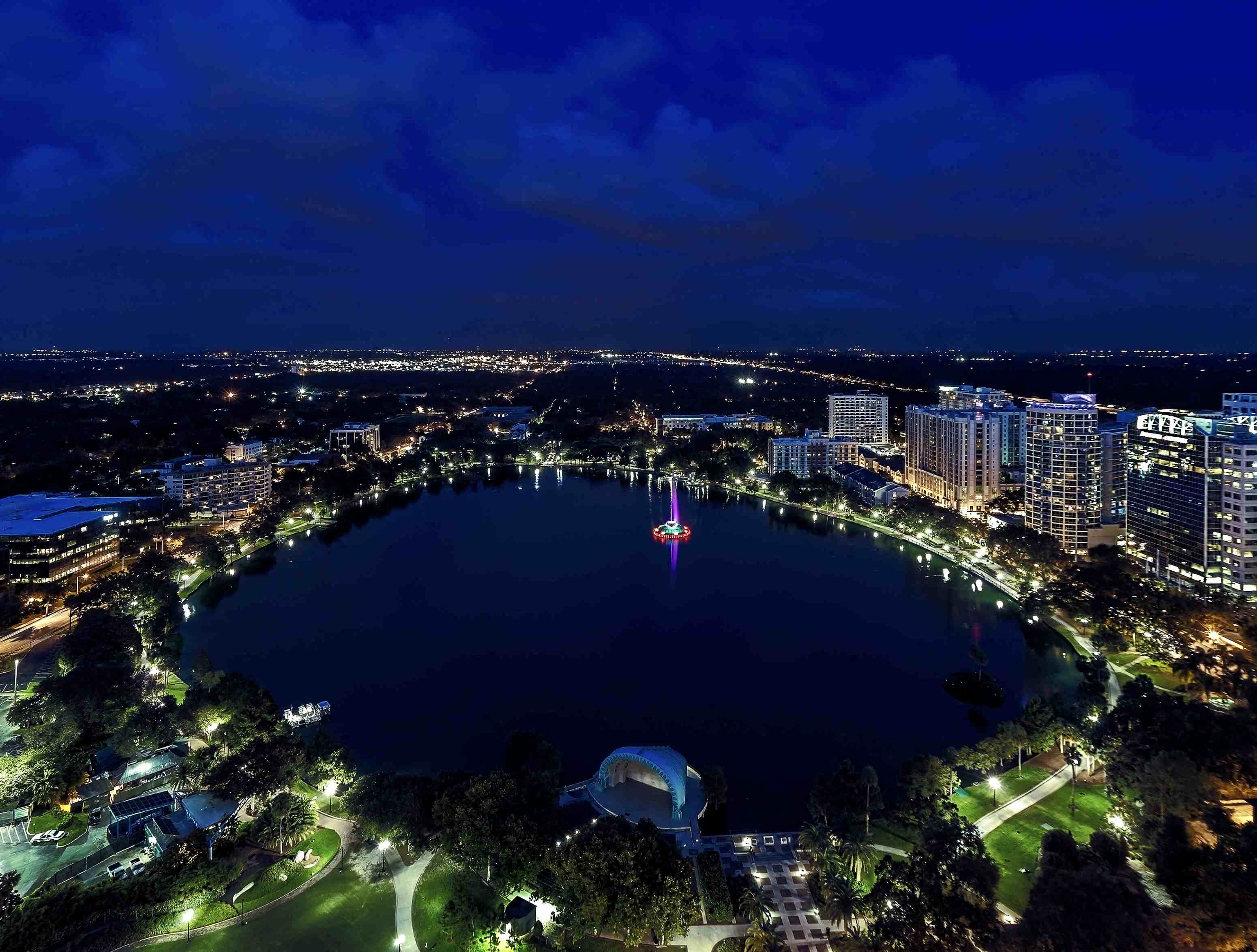 a night view of the city and lake at night