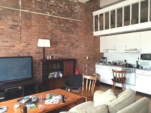 a living room with a table and a television