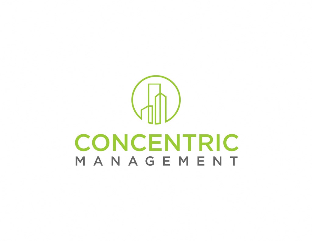 a logo for a manufacturing company with a building in a circle