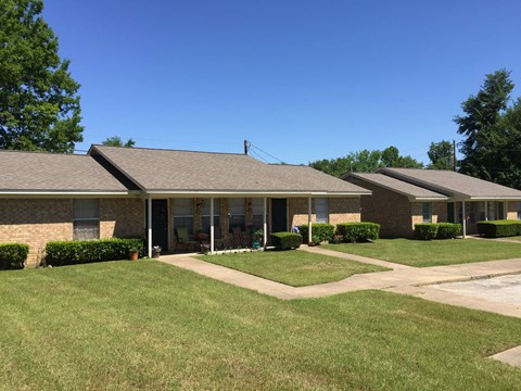 a house with a lawn in front of it