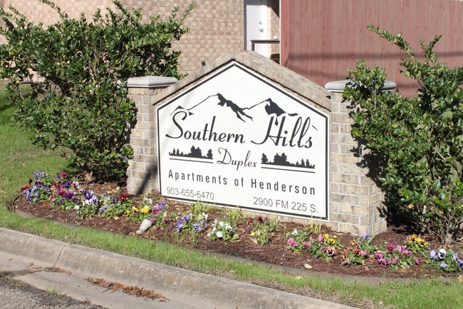a sign for southern hills depot in front of a building