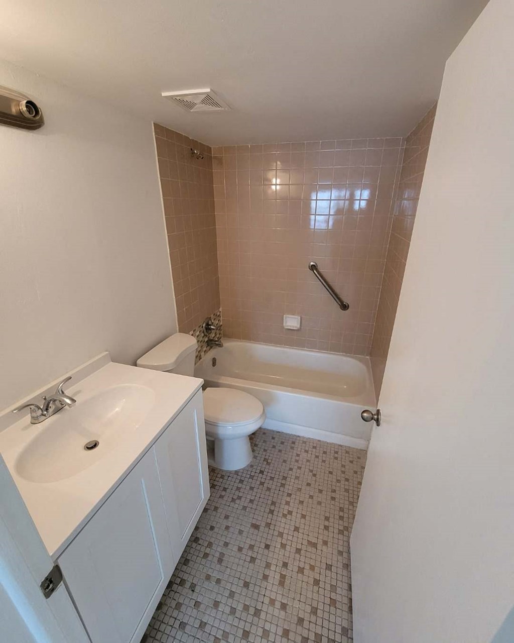 a bathroom with a sink toilet and a bath tub