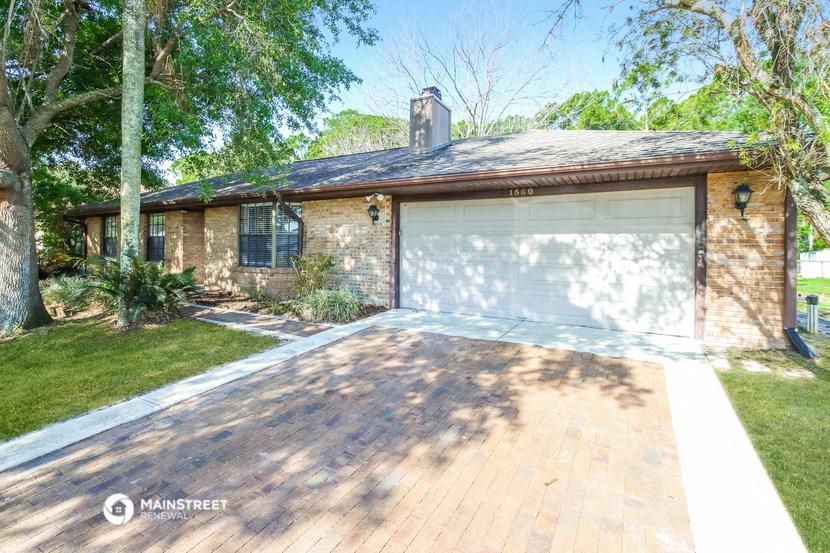 a house with a driveway and a garage door