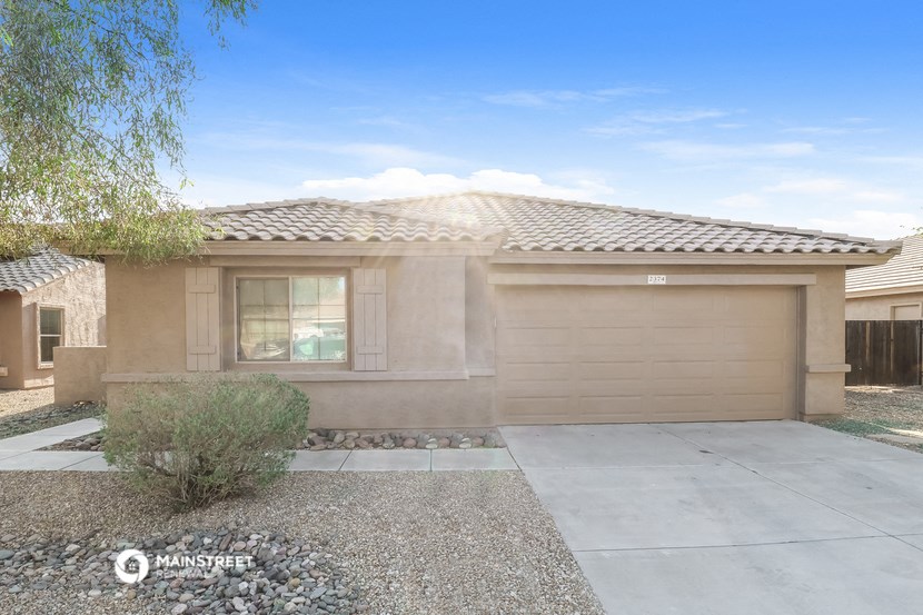 a home with a driveway and a garage door