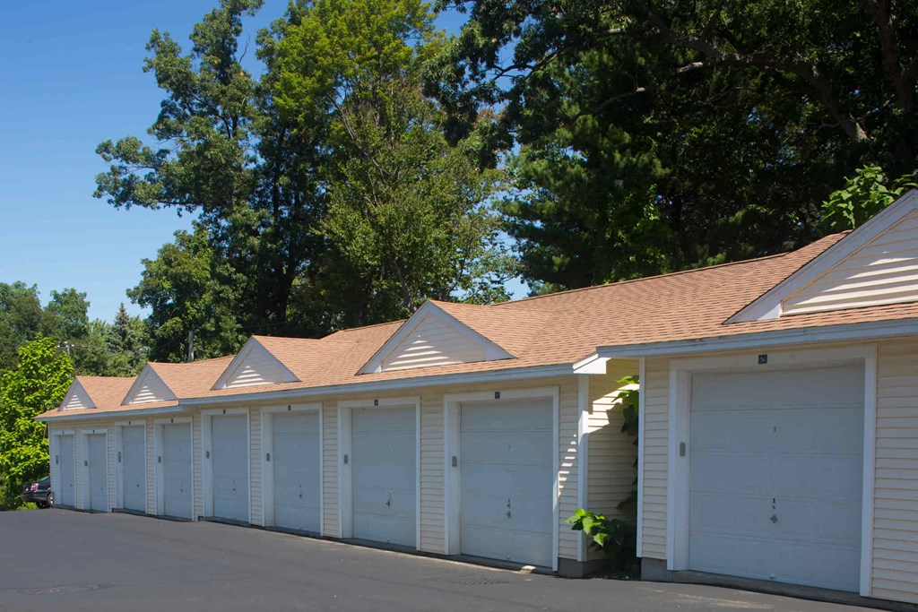 A row of white garage doors are closed.