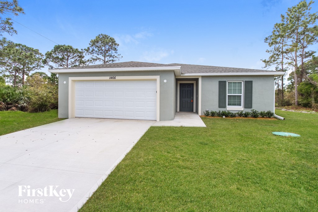 A house with a garage door that says "FirstKey Homes".