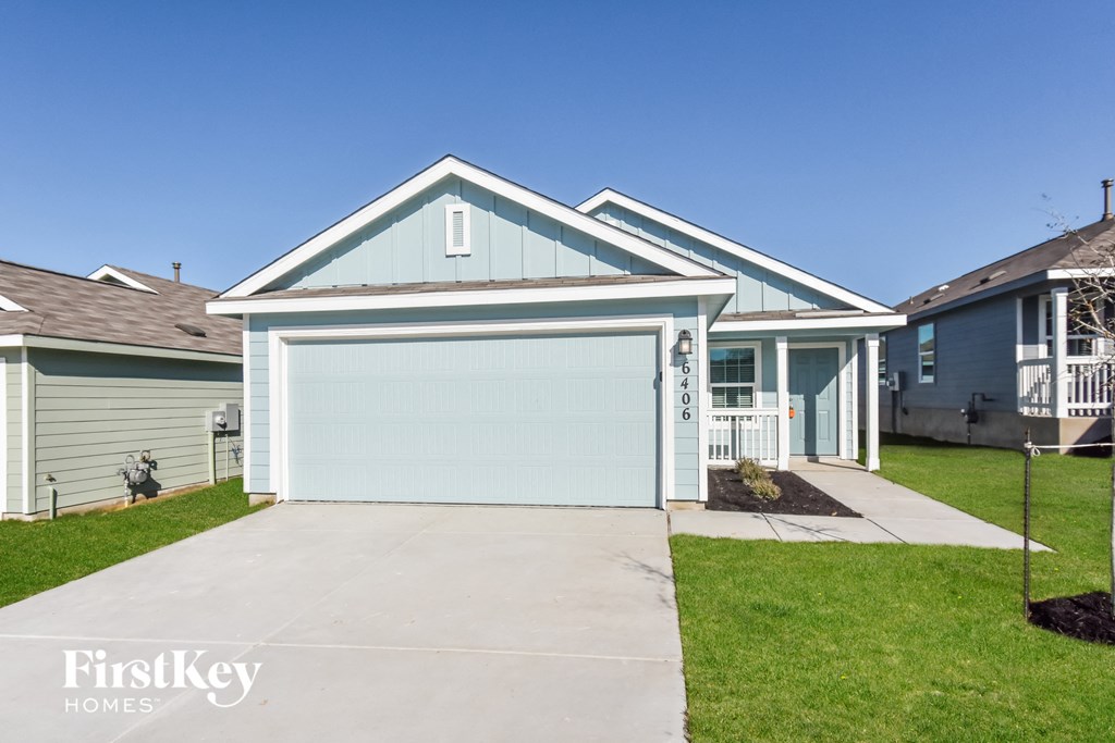 A blue house with a garage door that says "FirstKey Homes".