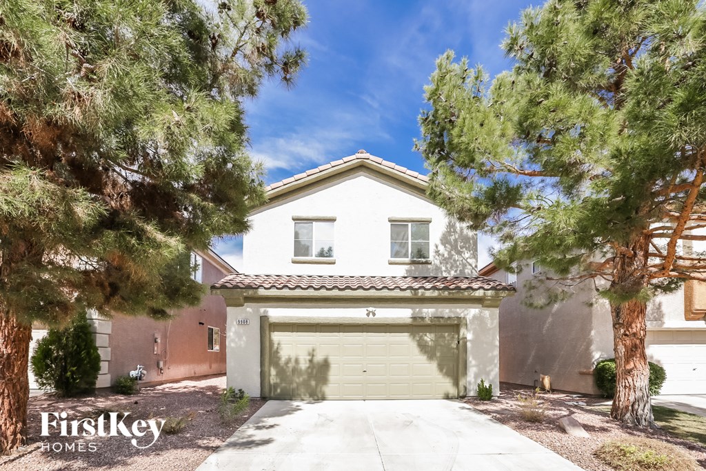 a white house with a yellow garage door