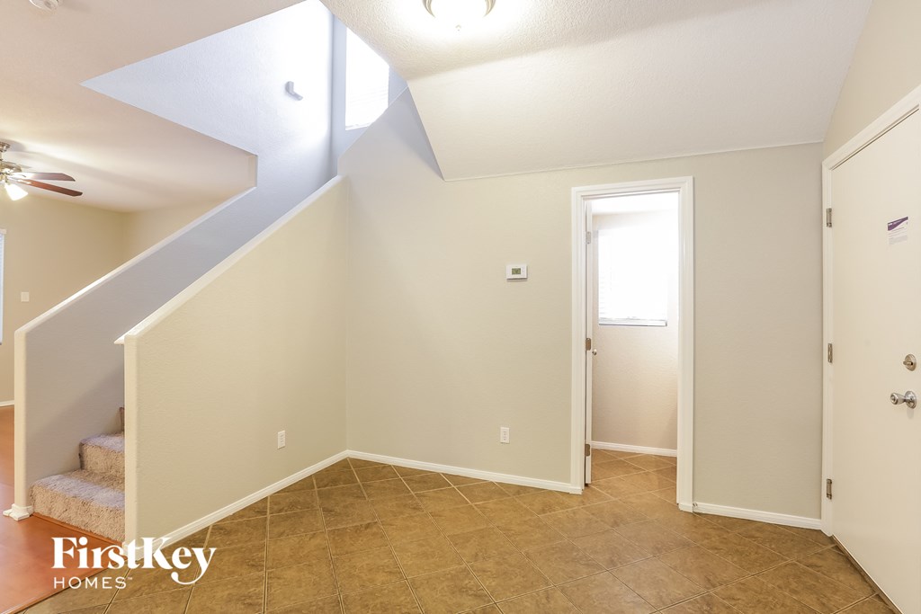 the upstairs hall with a door to the closet and stairs to the loft