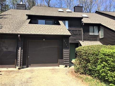 the front of a house with a garage door