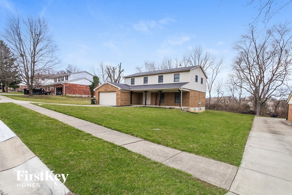 A house with a lawn in front of it.