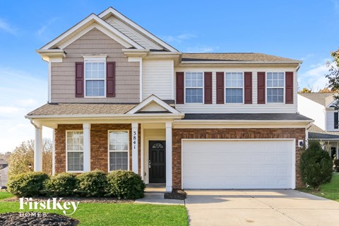 A two-story house with a garage is for sale by FirstKey Homes.