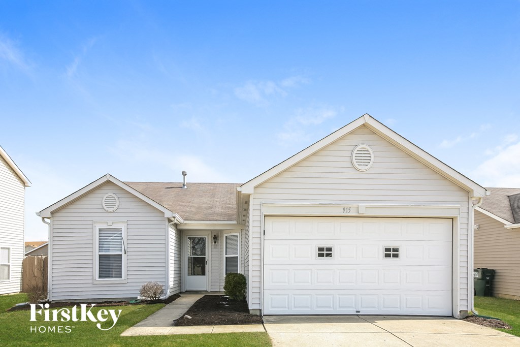 A two-car garage is attached to a house.
