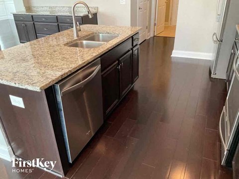 a kitchen with stainless steel appliances and a granite counter top