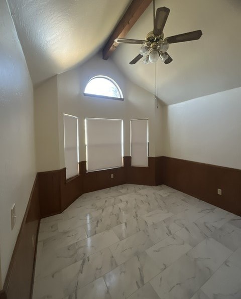 a empty room with a ceiling fan and a window