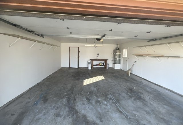 an empty garage with a table in the middle of it