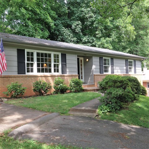 a house with an flag in the front yard