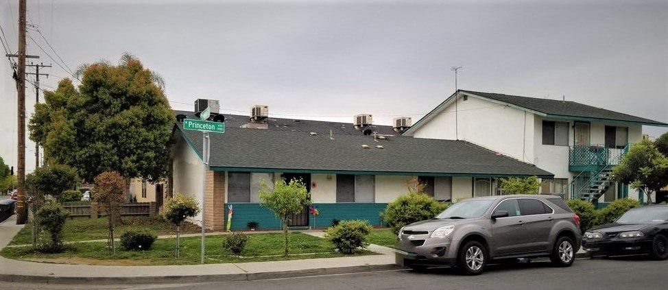 a house with cars parked in front of it
