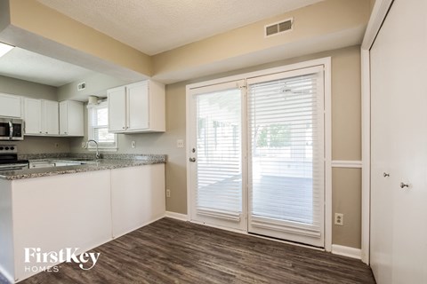 A kitchen with a counter top and cabinets.