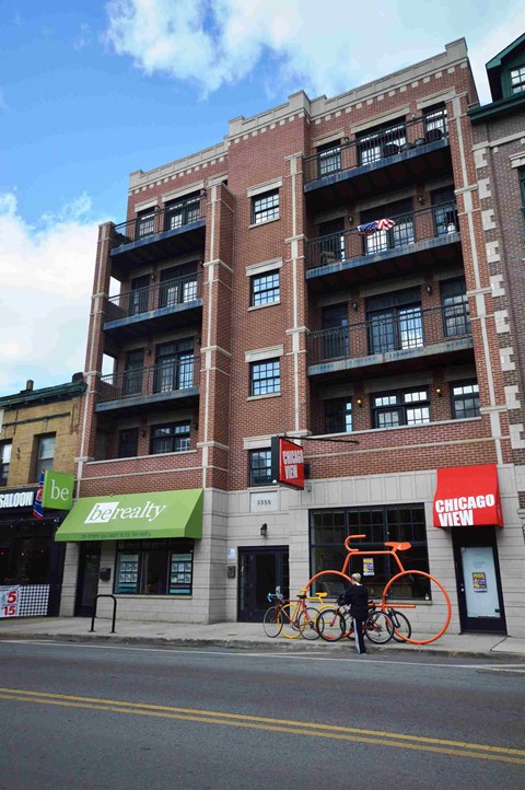 a large brick building with bikes parked outside of it