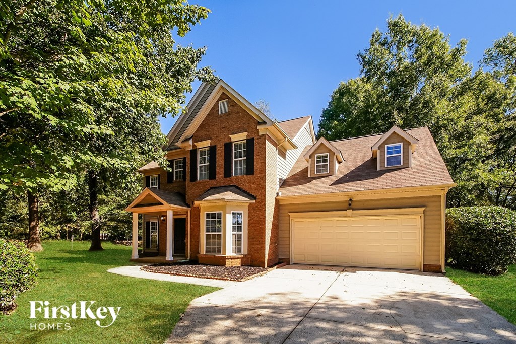 A house with a garage is for sale by FirstKey Homes.