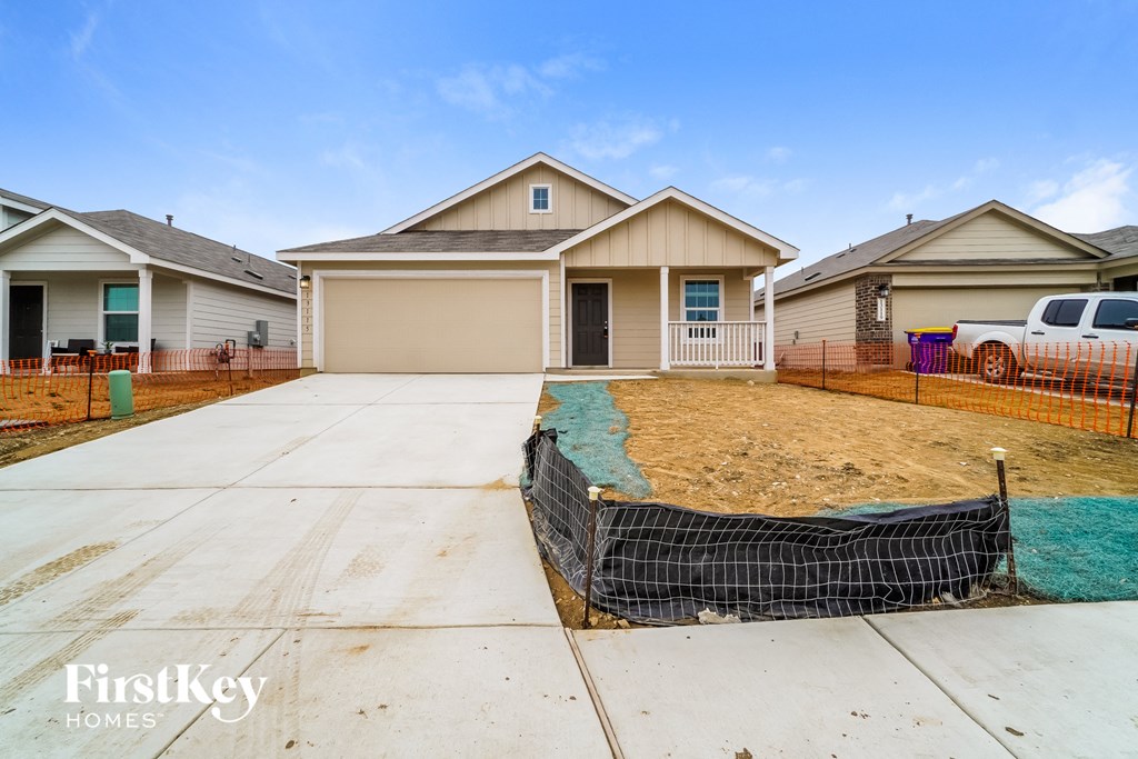 A house with a garage is for sale by FirstKey Homes.
