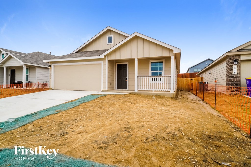 A house with a garage is for sale by FirstKey Homes.