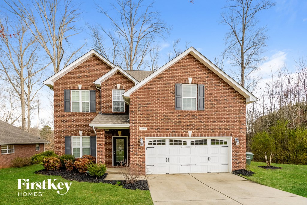a brick house with a white garage door