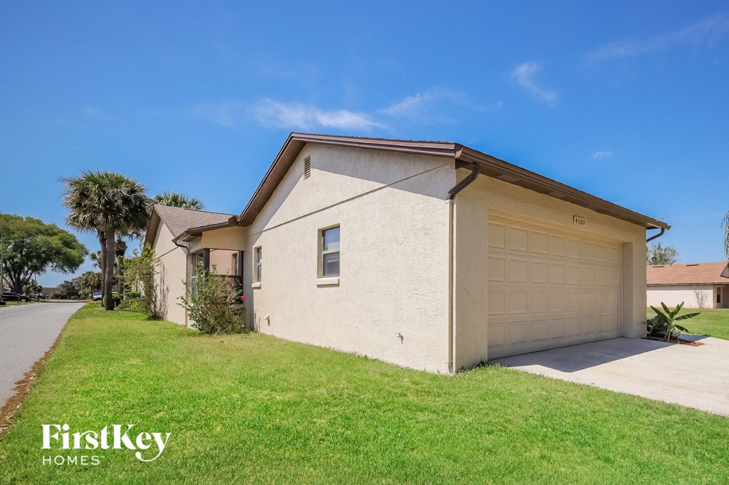 A house with a garage is for sale by FirstKey Homes.