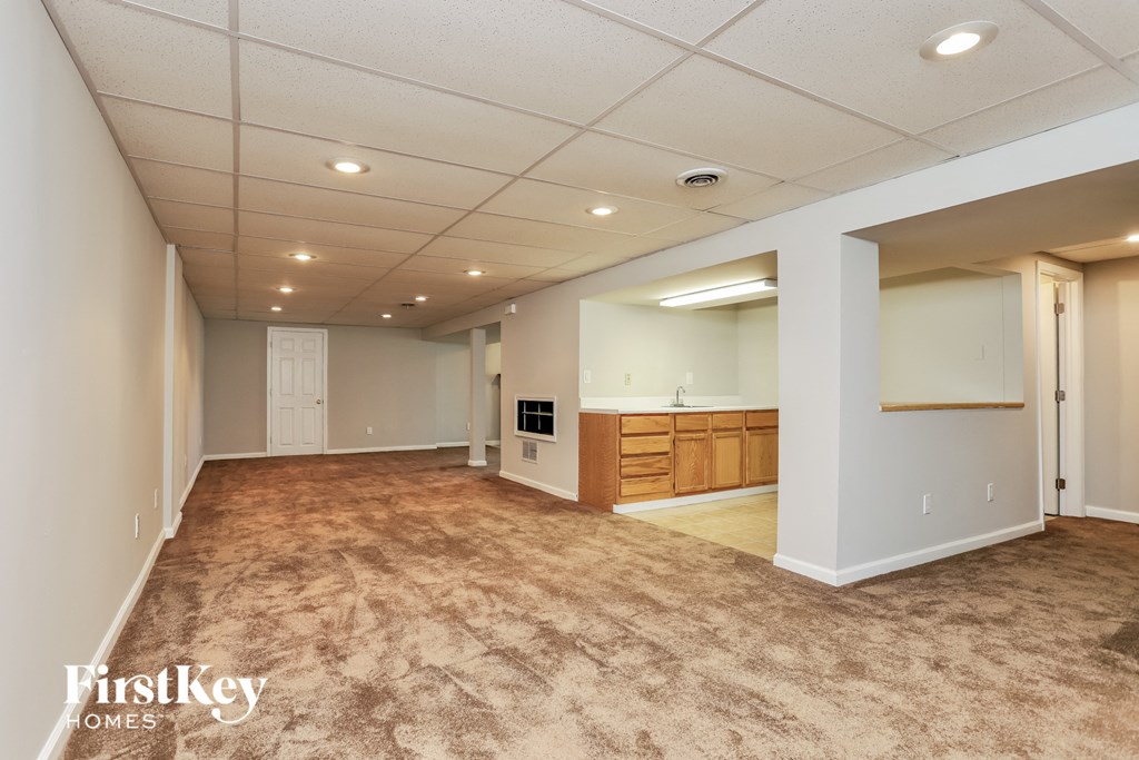 an empty living room and kitchen in a new home