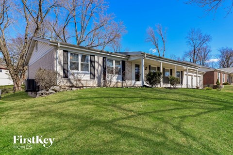 A house with a lawn in front of it.