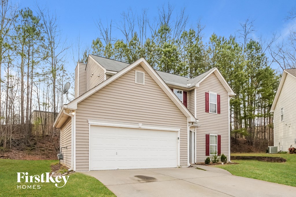 A house with a garage is for sale by FirstKey Homes.