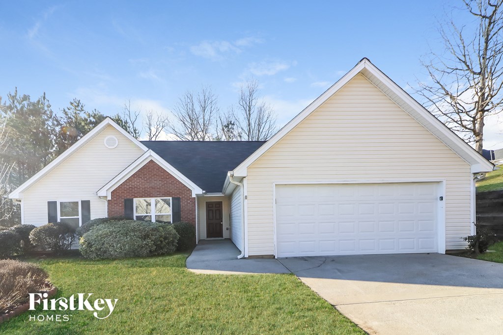 a white house with a white garage door