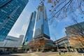 a view of a tall skyscraper in the middle of a city