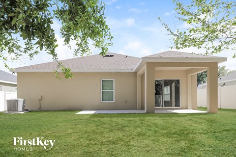 a house with a grass lawn and a door