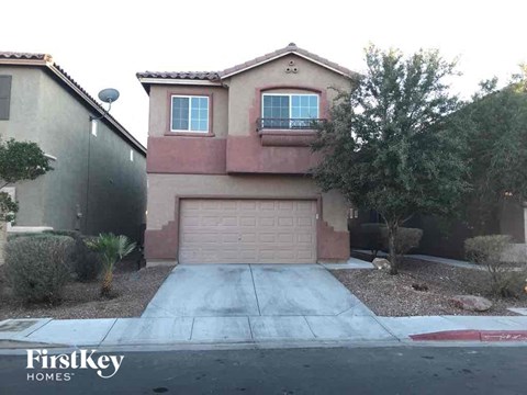 a house with a driveway and a garage door
