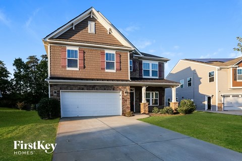 A house with a garage is for sale by FirstKey Homes.