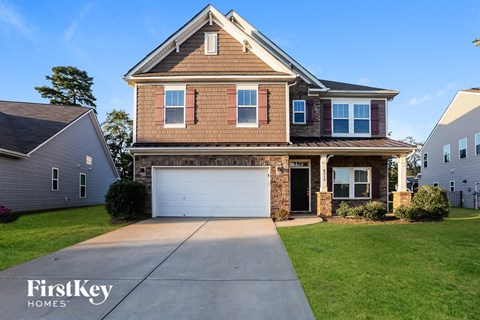 A house with a garage is for sale by FirstKey Homes.