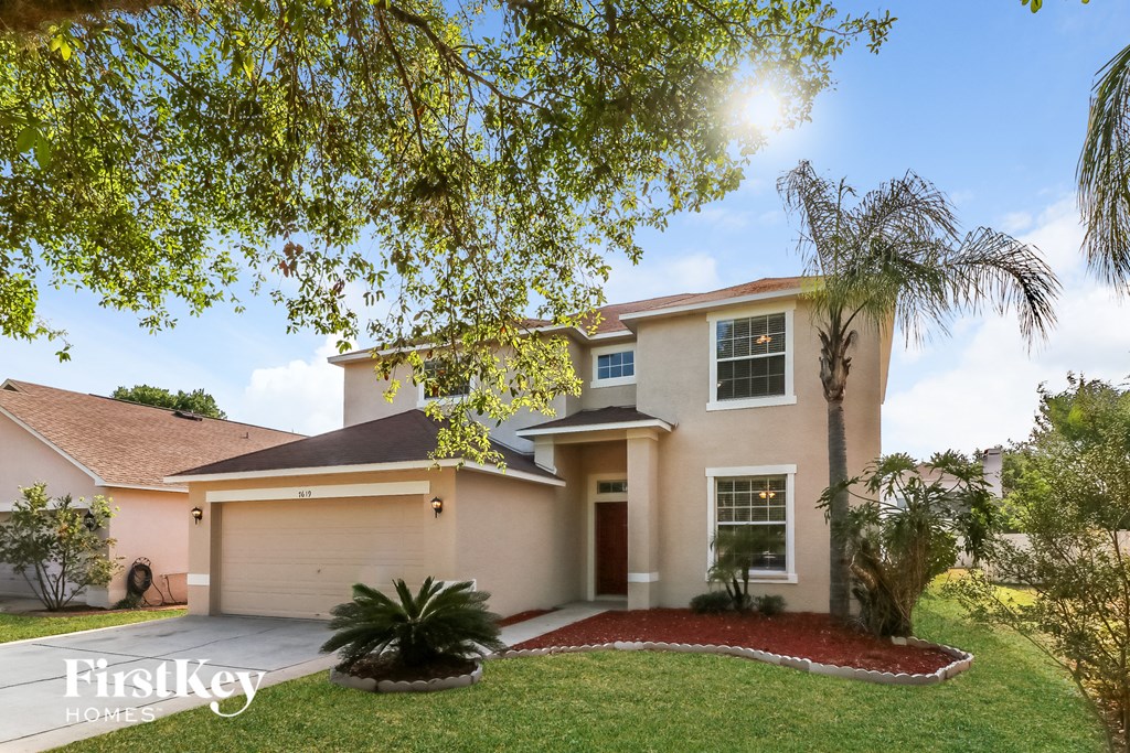 a house with a palm tree in front of it
