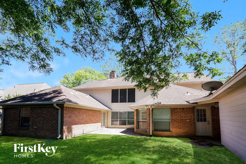 a house with a yard and a tree