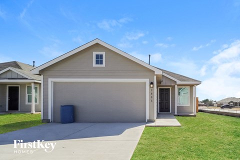 A two-car garage is attached to a house.