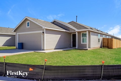 A house with a garage is for sale by FirstKey Homes.