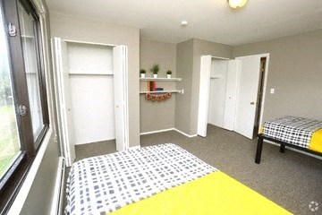 Smaller bedroom with two closets