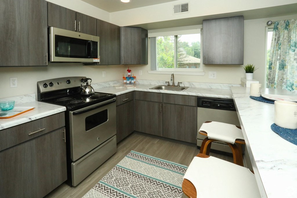 Modern kitchen with stainless appliances New apartments with modern kitchen