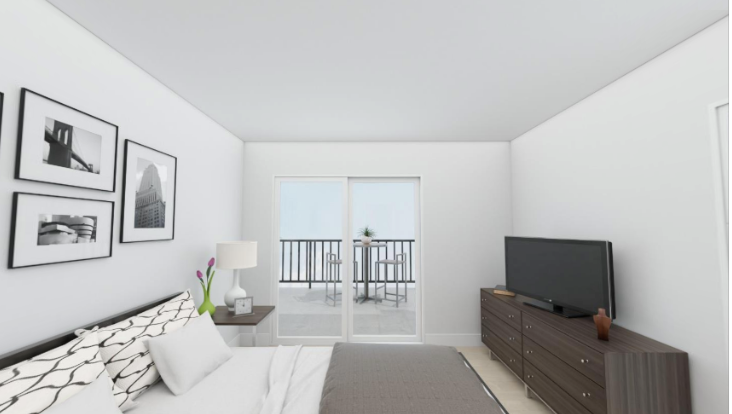 a bedroom with a bed and a tv and a balcony