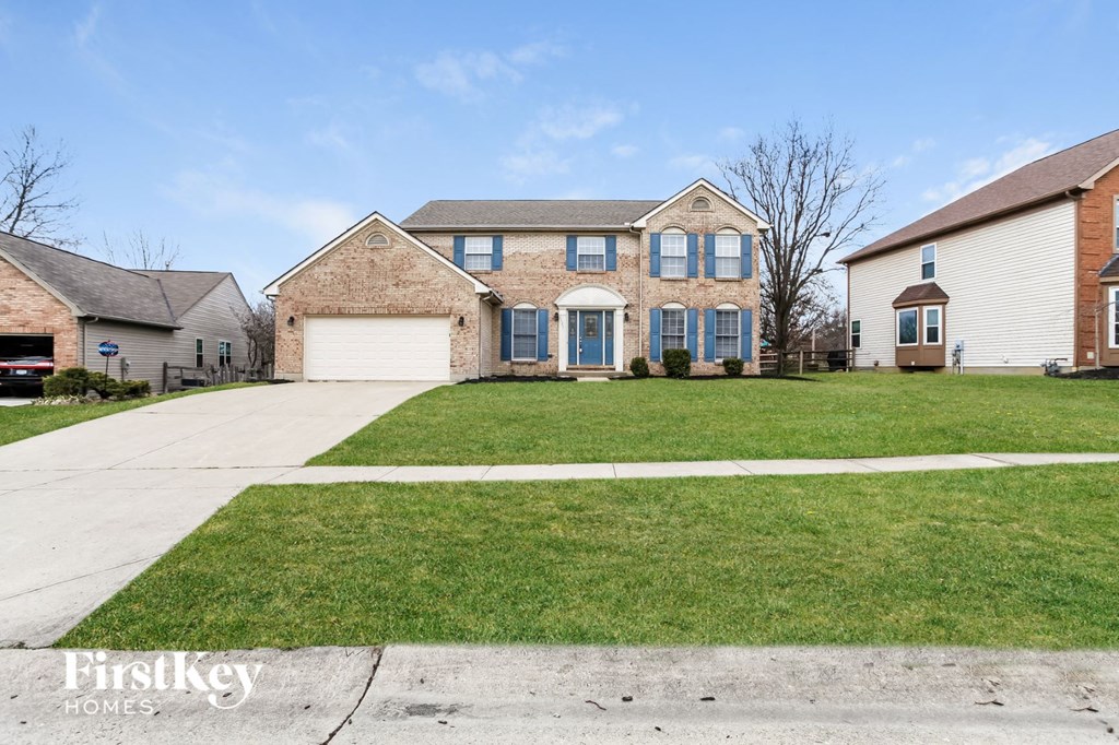 A house with a driveway in front of it.