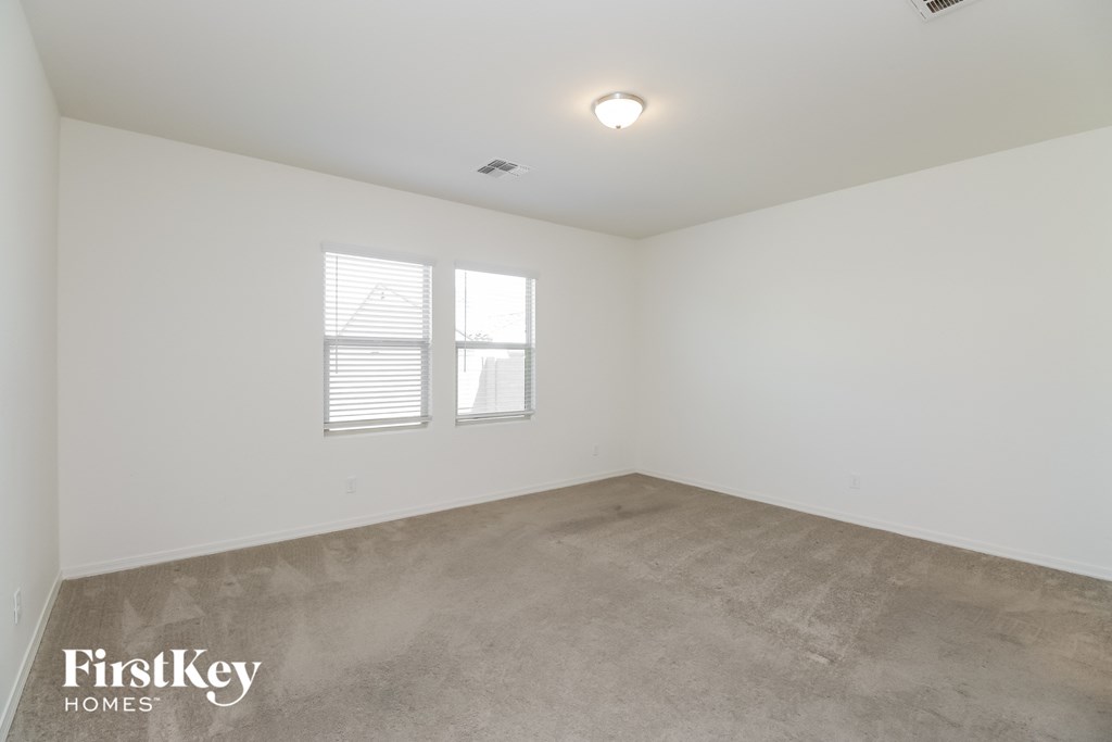 A room with a FirstKey Homes logo on the floor.