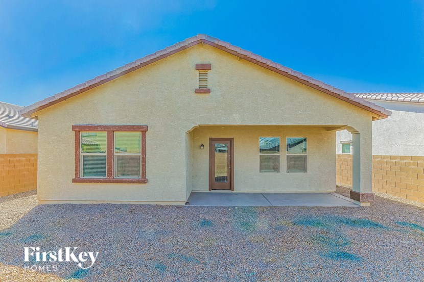 the front of a house with a door and a driveway