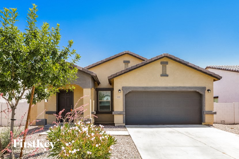 a house with a garage door and a driveway
